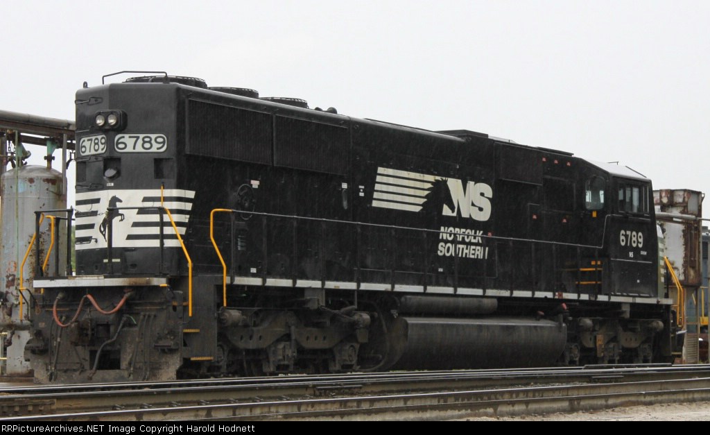 NS 6789 sits in the fuel racks in the rain